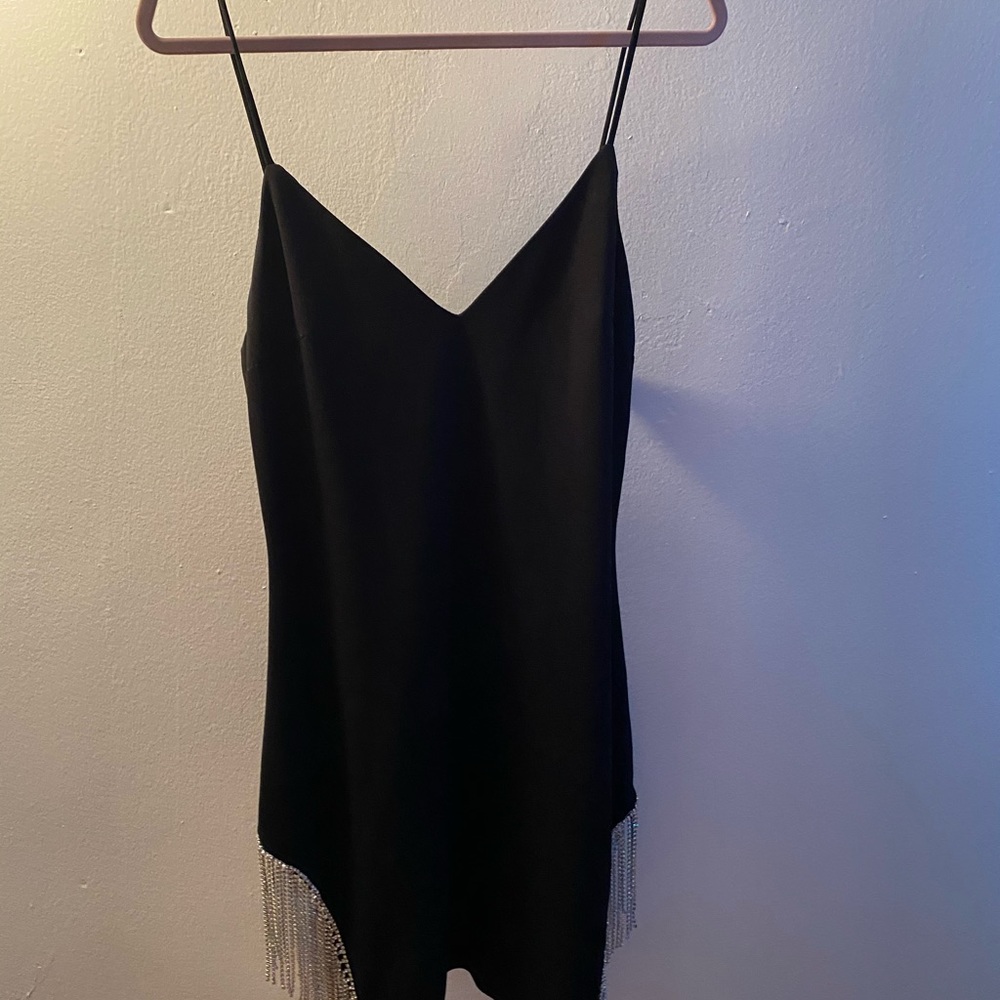 Black spaghetti strap dress with silver tassels